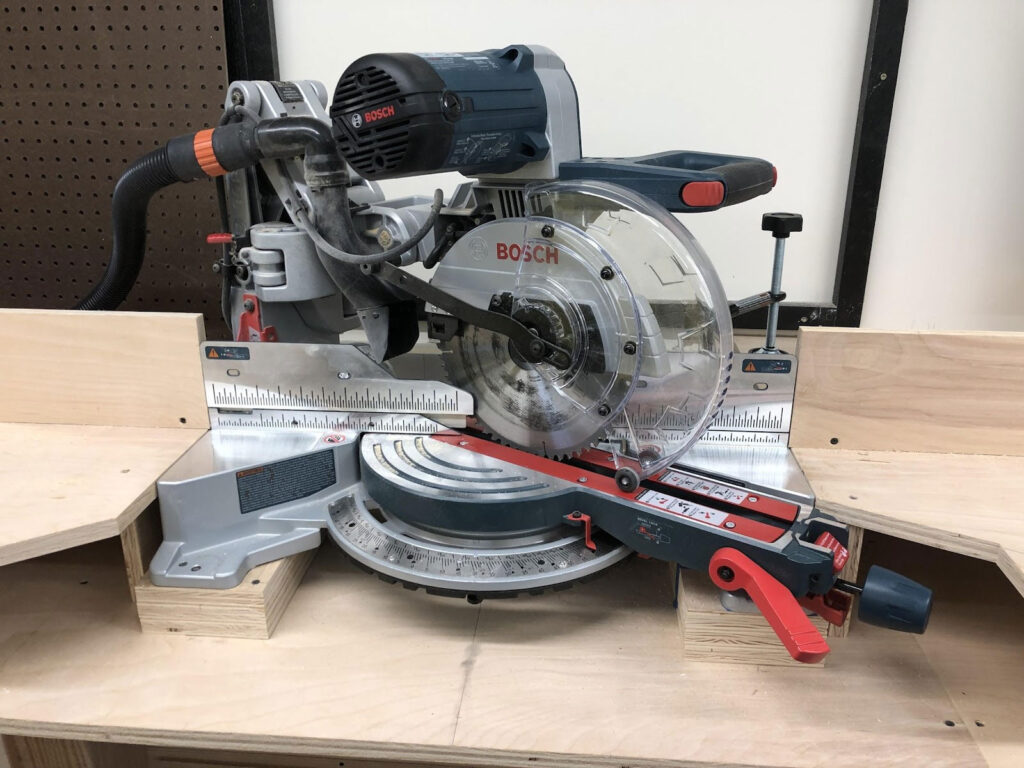 Miter saw after being cleaned up properly, with blade locked down and set to a 60degree miter angle Northeastern Makerspaces