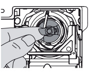 Pulling the lever to remove the bobbin casing from the bottom of a Bernina sewing machine, Northeastern Makerspaces