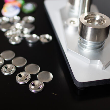 Button maker with button blanks