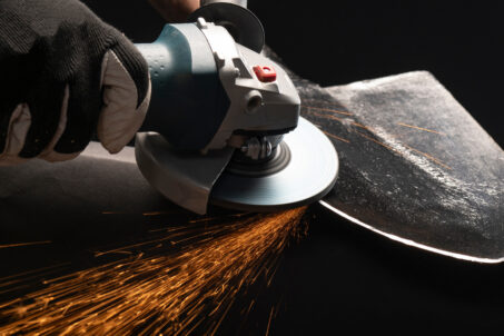 Person using an angle grinder