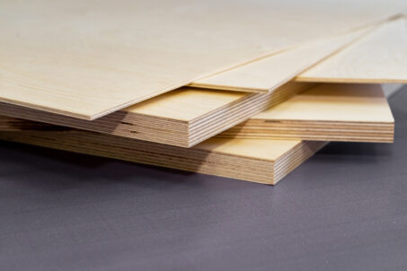 A stack of multiple birch plywood sheets.