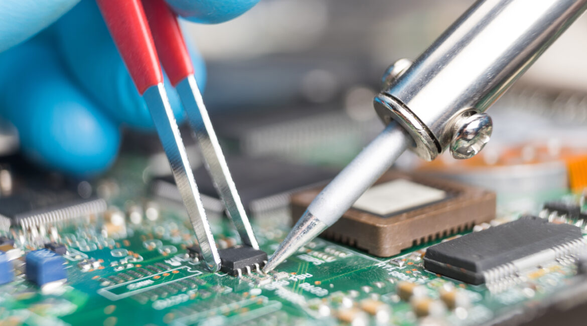 Close up of soldering a printed circuit board