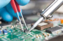 Close up of soldering a printed circuit board