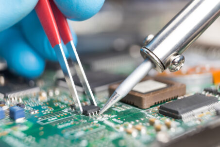 Close up of soldering a printed circuit board