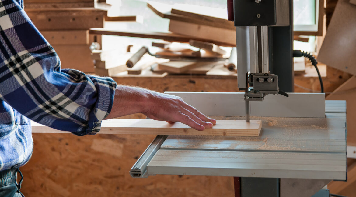 Cutting a piece of wood on a band saw