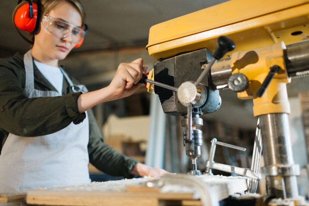 Person using a drill press