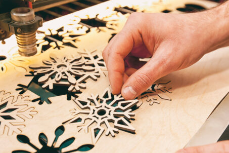 Laser cut snowflakes out of plywood