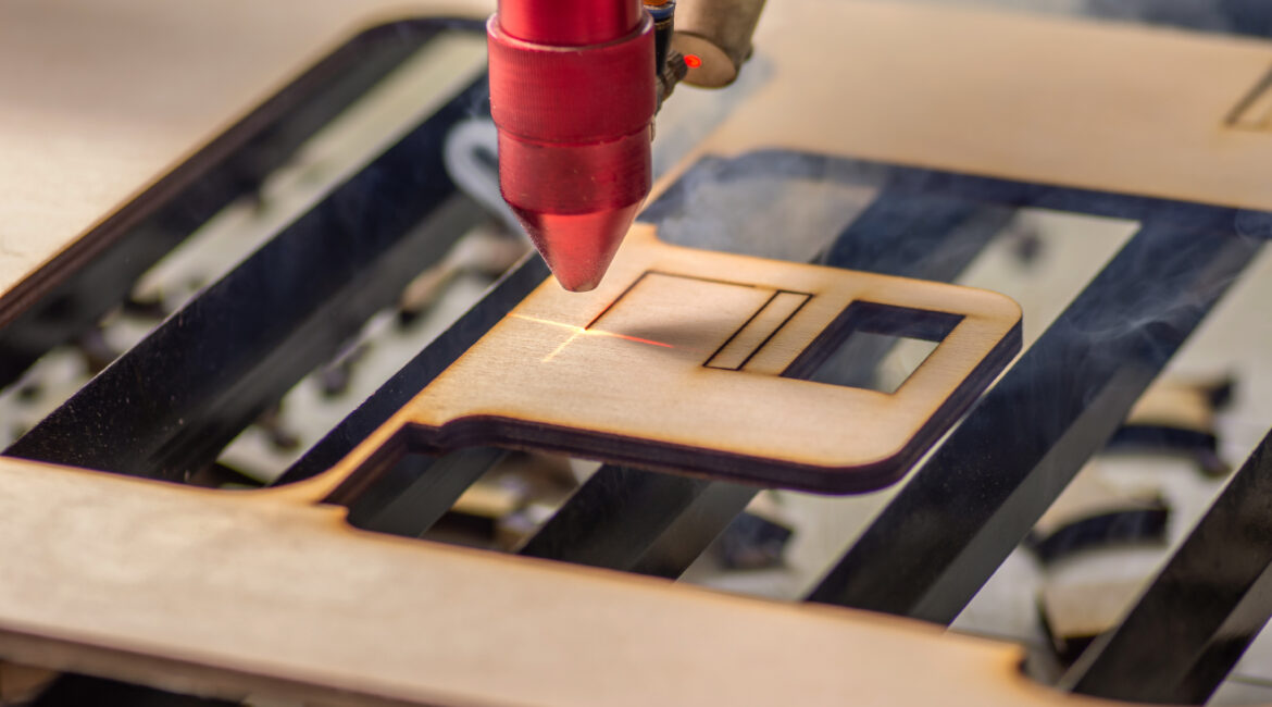 Laser cutting cutting out a piece of plywood