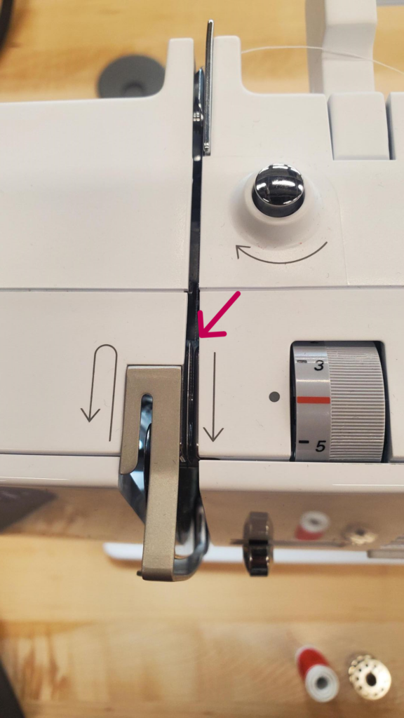 Metal lever when threading sewing machine