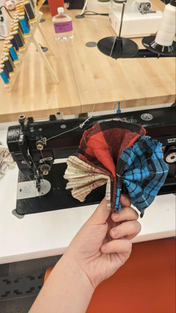 A sewn fabric fan fanned out.