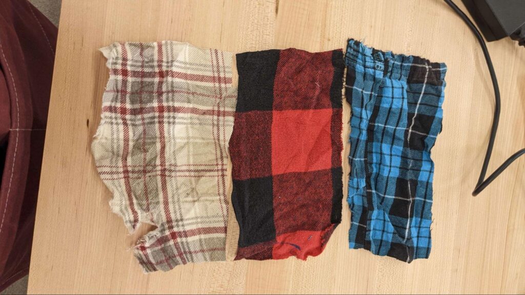 Three pieces of flannel fabric.