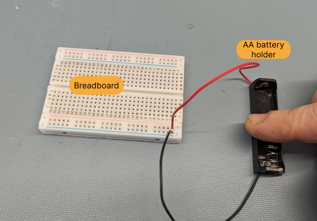 AA battery holder connected to solderless breadboard