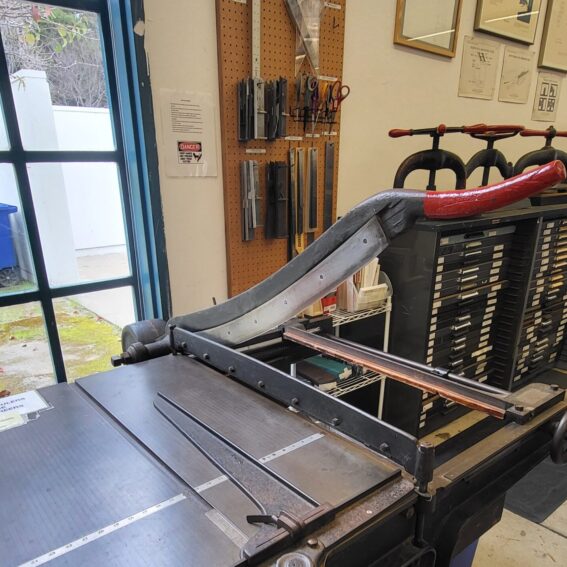 Board shear in the Analog Print Lab.