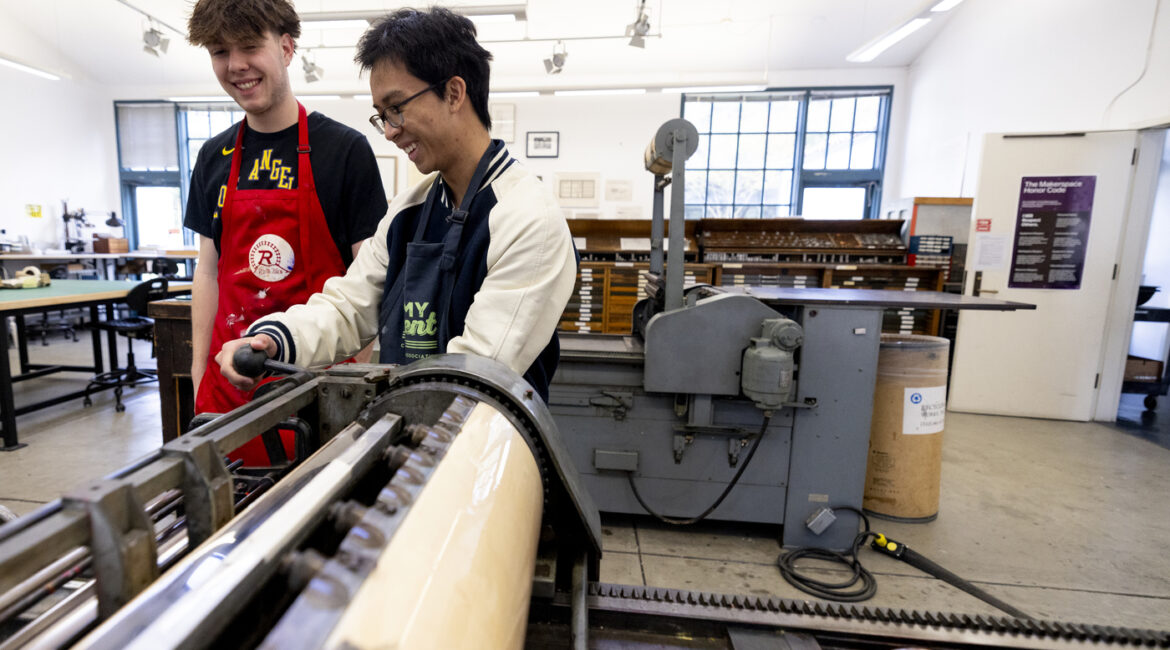 Two students work in the Analog Print Lab.