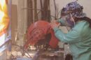 A person working with metal