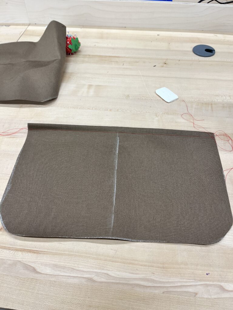 brown fabric with white line down the center