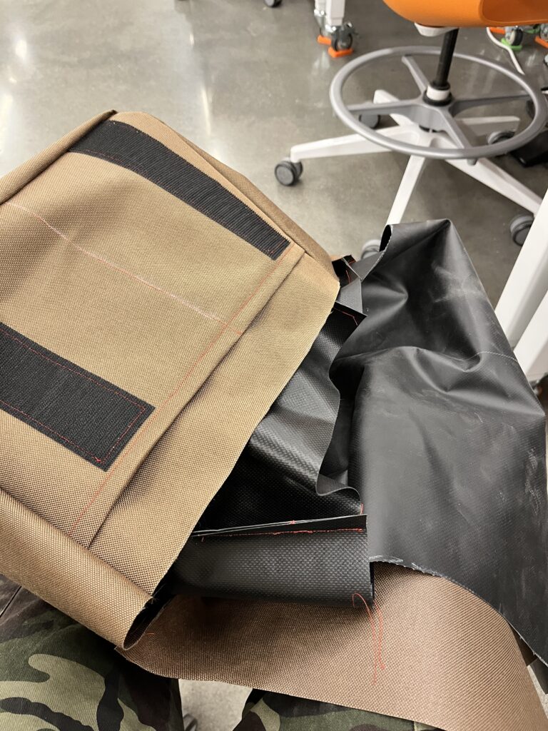 brown bag with black lining on inside