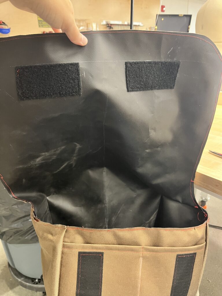 edge of bag sewn with red fabric