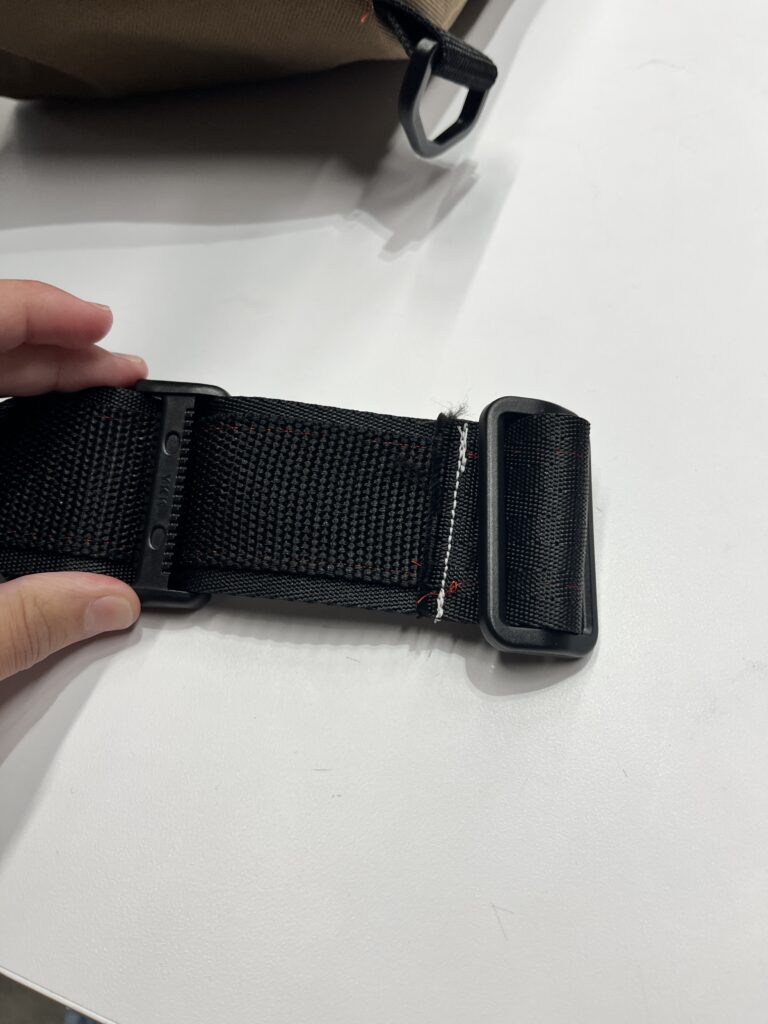 back side of strap with buckle and tribar
