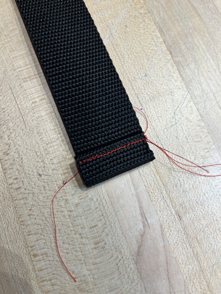 strap with 1/2" folded seam at the end