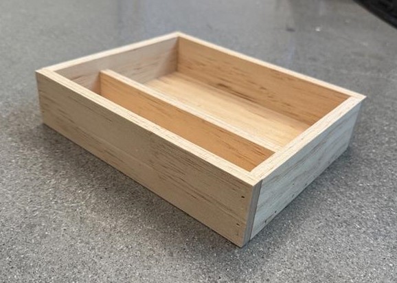 A desk organizer made out of wood
