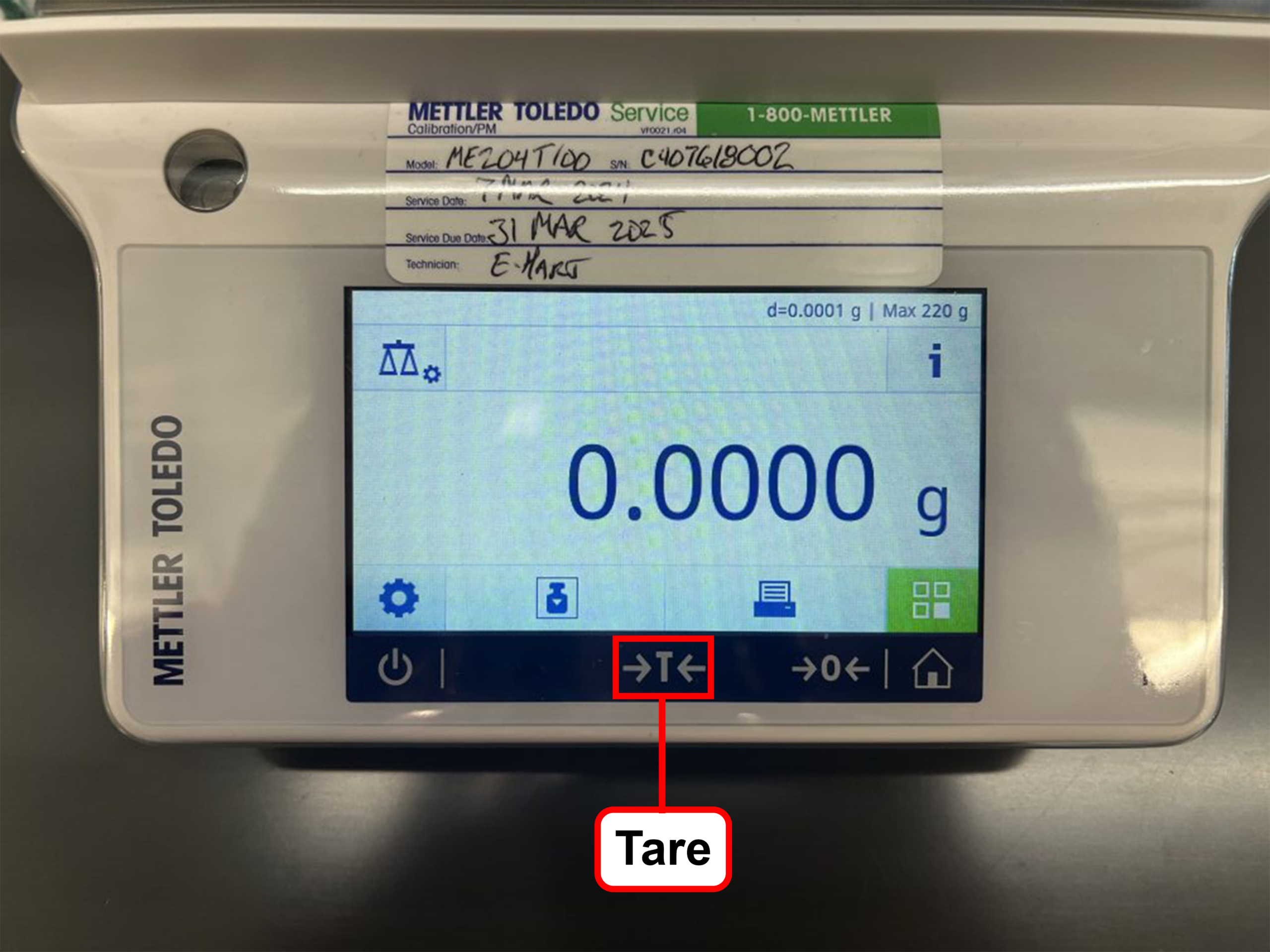 Balance display highlighting the Tare button