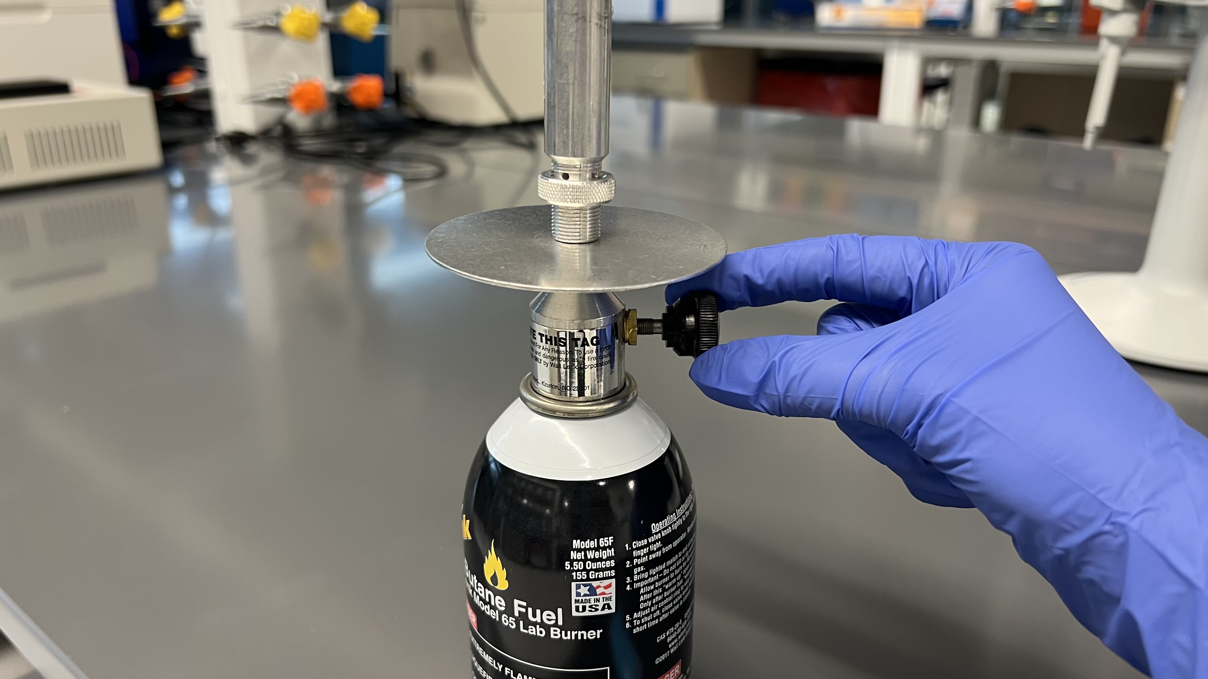 Opening the gas valve on the butane burner
